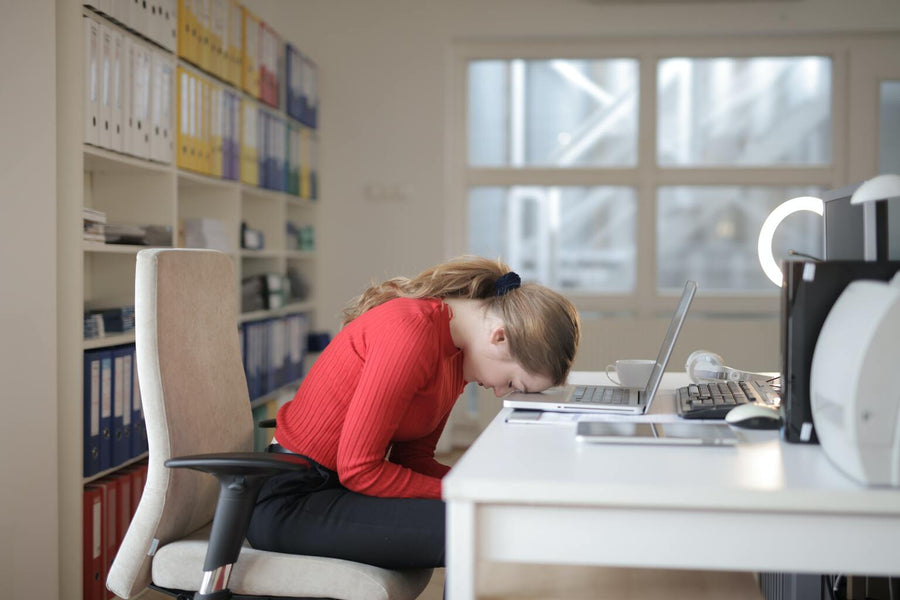 Fatigued woman at desk