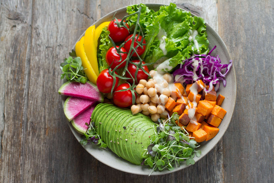 Bowl of fresh vegetables, chickpeas, and avocado